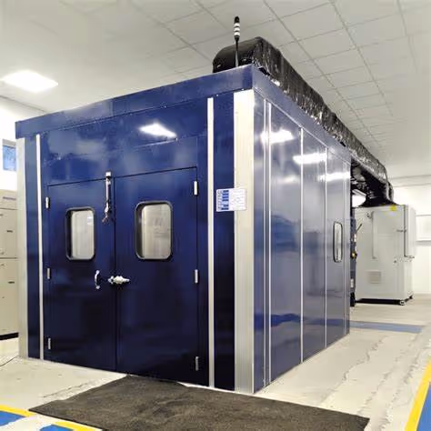 Industrial machinery housed in a modular acoustic test enclosure during certified runoff testing