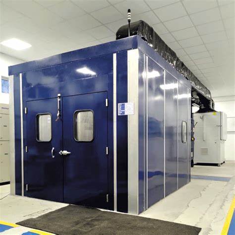 Industrial machinery housed in a modular acoustic test enclosure during certified runoff testing