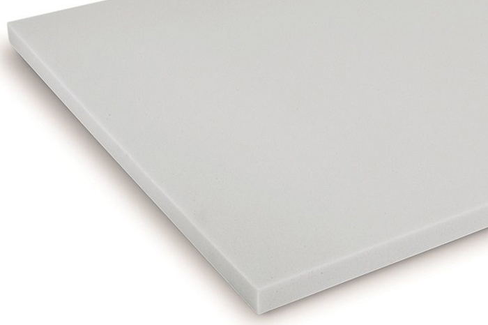 Close-up of a white acoustic foam panel, designed for sound absorption in commercial and industrial noise control applications.