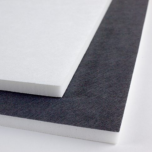 Two stacked rectangular ceiling tiles, one white and one dark gray, photographed on a white surface.