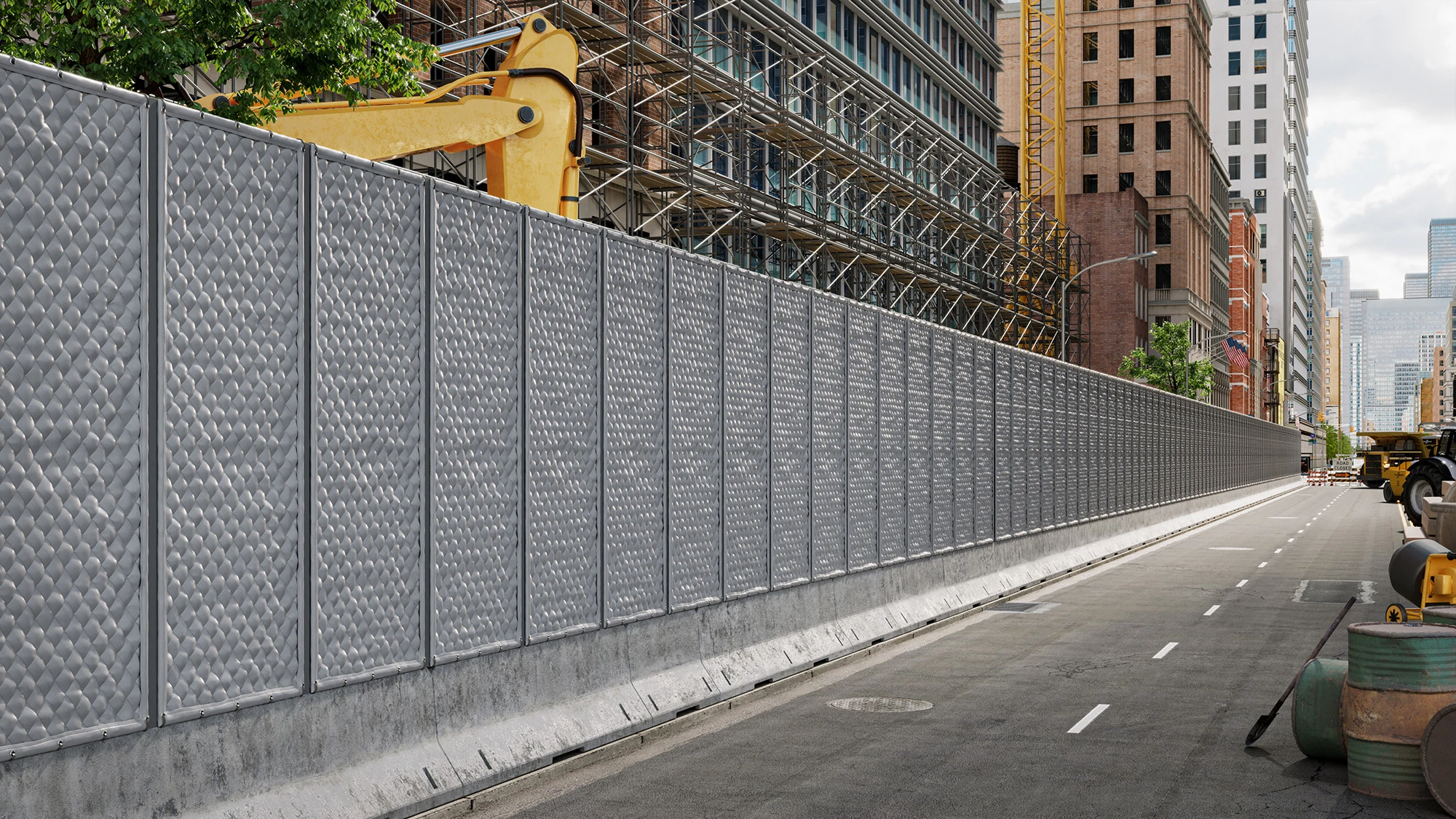 Long metal construction barrier fence lining a city street with scaffolding and construction equipment behind it.
