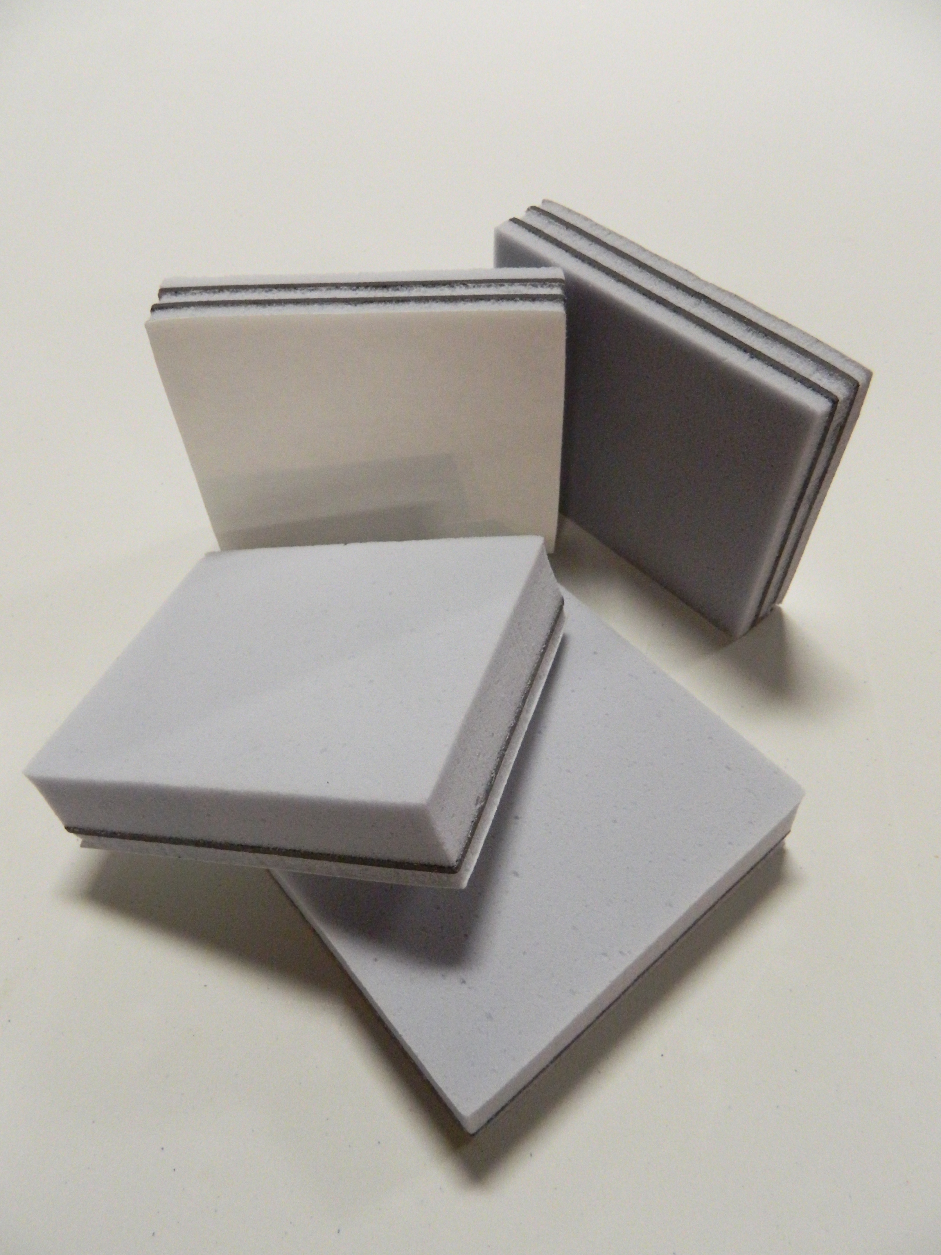 Cross-section of Memtech acoustic composite showing foam absorber, vinyl noise barrier, and decoupling layers