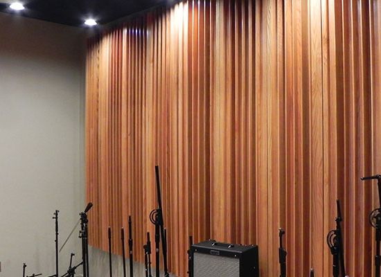 MidTones wood diffuser by Kinetics Noise Control, 18-inch wide hardwood diffuser panels tuned to scatter mid-frequency sound between 630 Hz and 2,500 Hz.