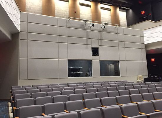 TAD tuned absorber and diffuser panel by Kinetics Noise Control, fabric-finished hybrid panel that absorbs mid-low frequencies while diffusing high frequencies.