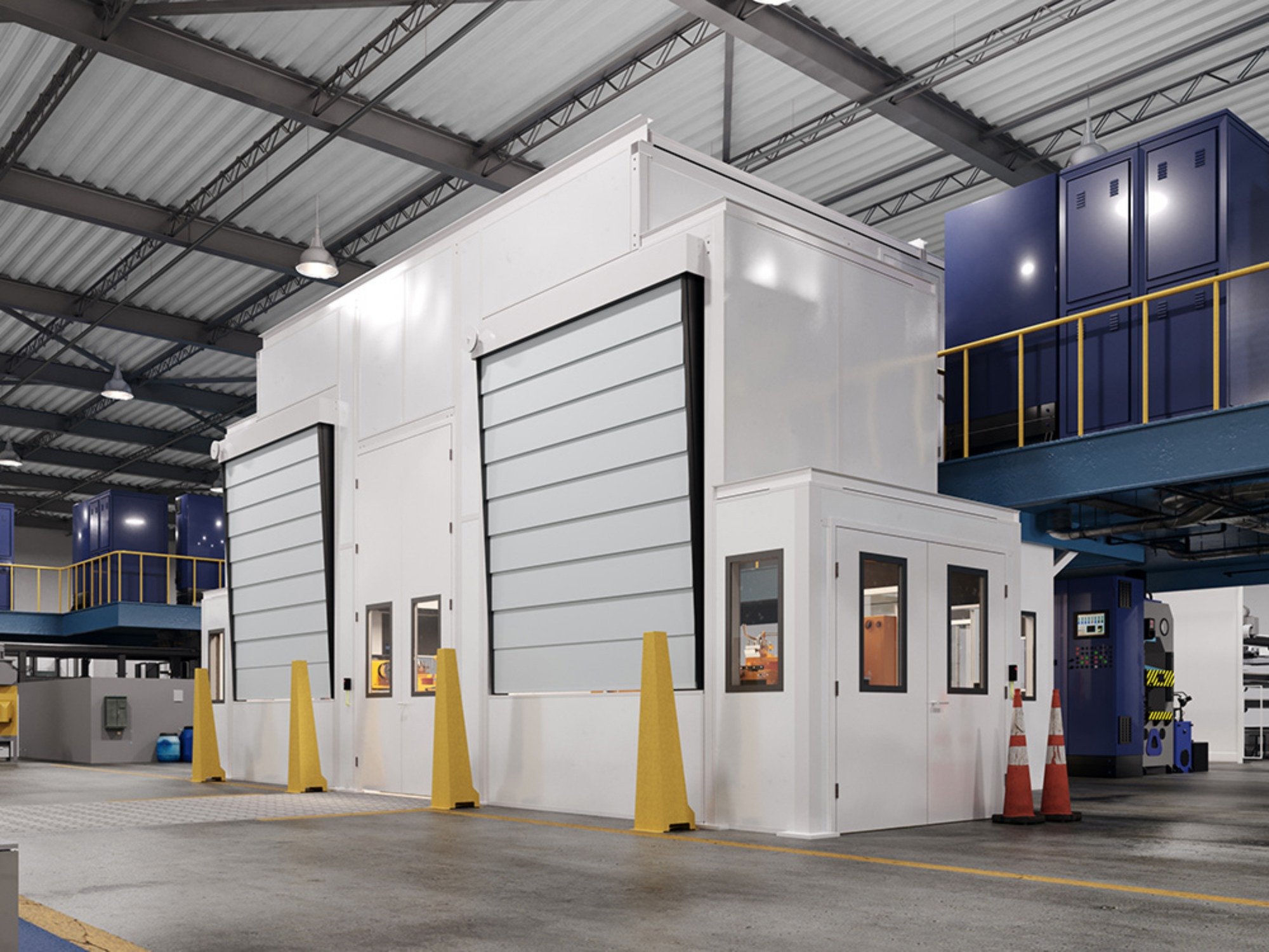 White modular acoustic enclosure with viewing windows and a personnel door on a factory floor.