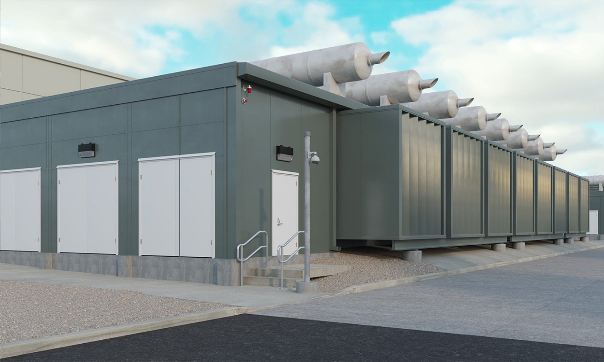 Engineered acoustic enclosure with rooftop exhaust silencers installed around mechanical equipment at a facility.