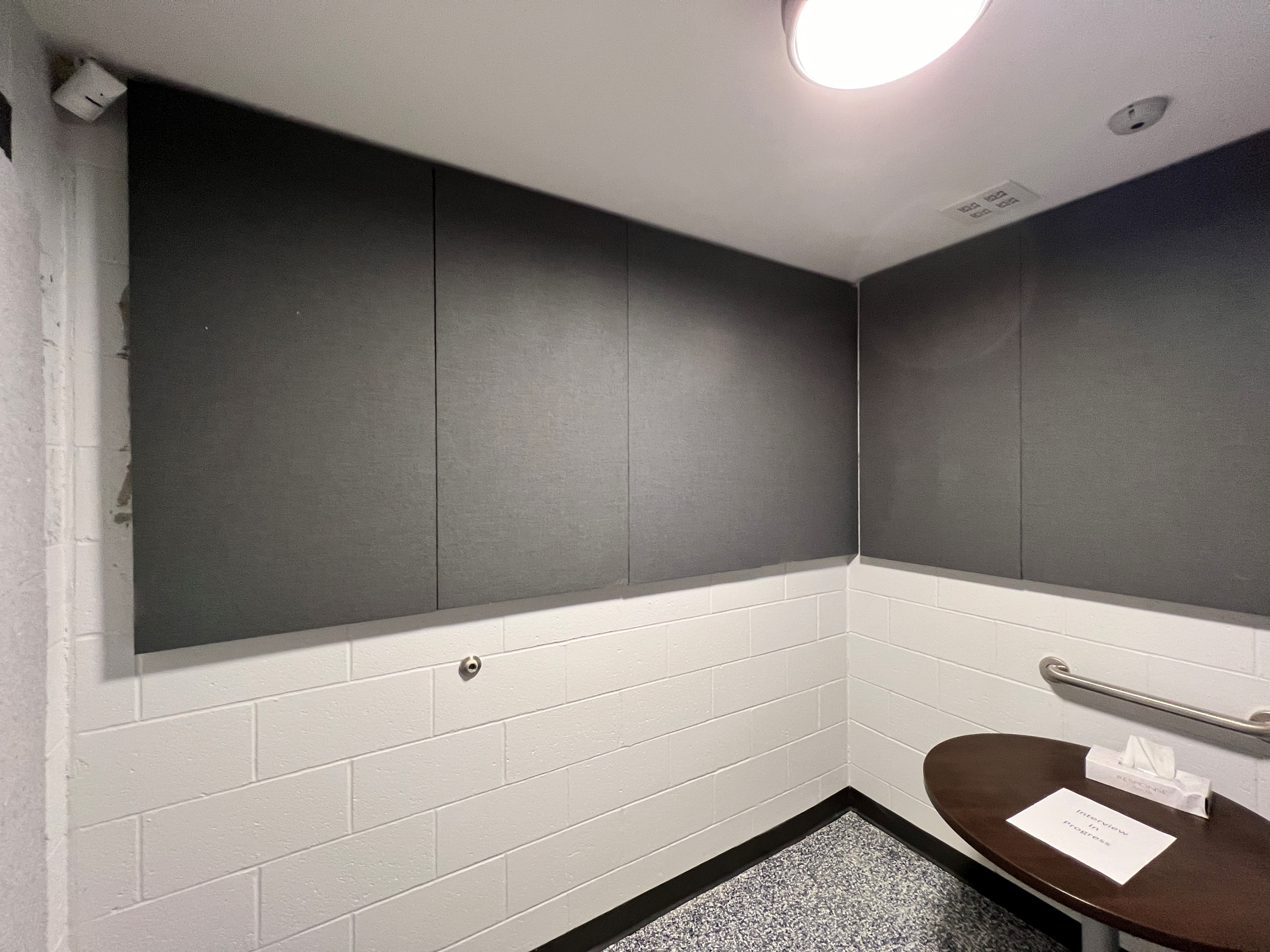 Public institutional interior with specified acoustic treatment