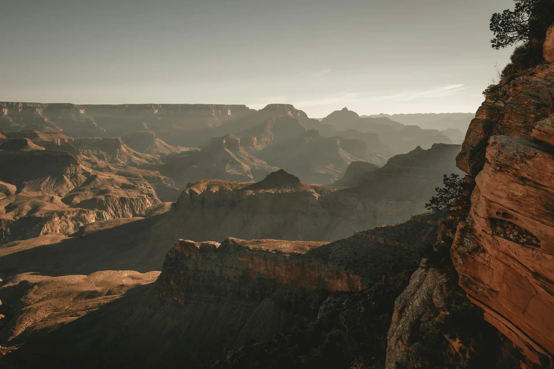 Majestic Grand Canyon landscape with layered rocky terrain at sunset