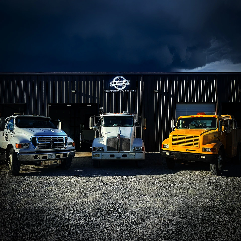Service vehicles for roadside assistance at R&D shop.