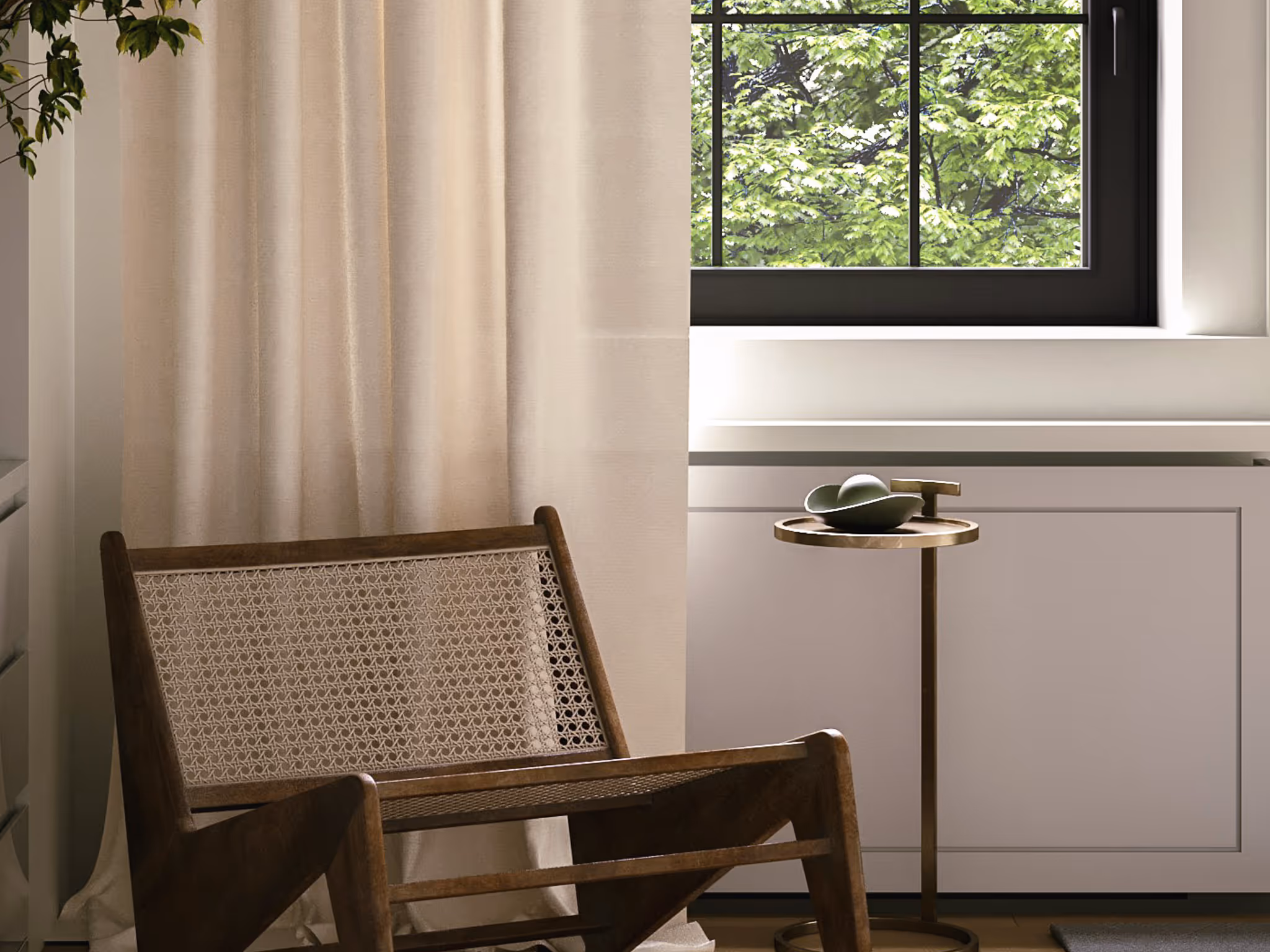 Sheer linen-look curtains filtering light next to a modern black window, rattan chair and brass side table