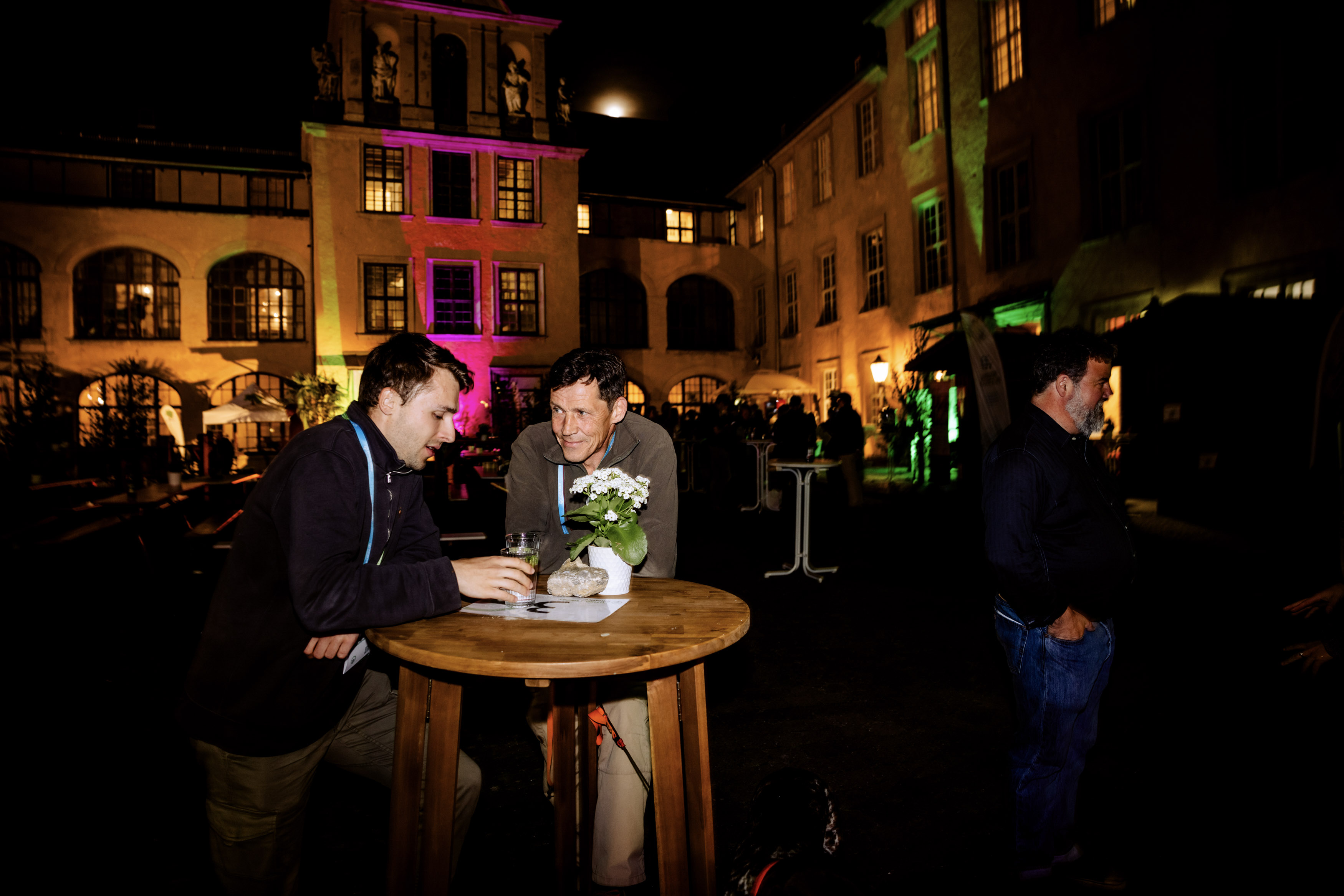 Picture of participants of Future Forest Forum networking during evening event in the castle courtyard