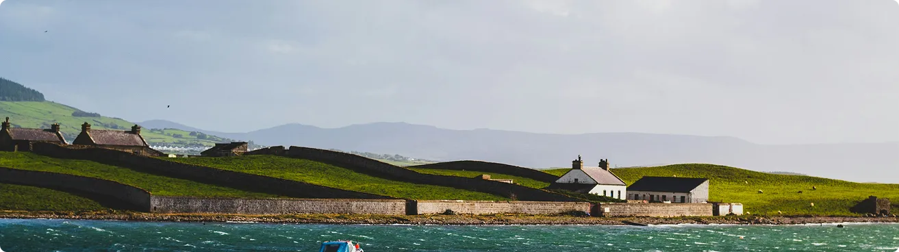 a landscape of hill and a house