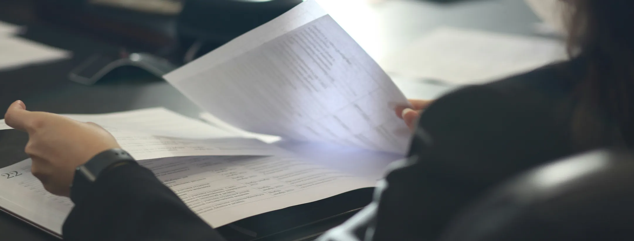 A person reviewing her documents