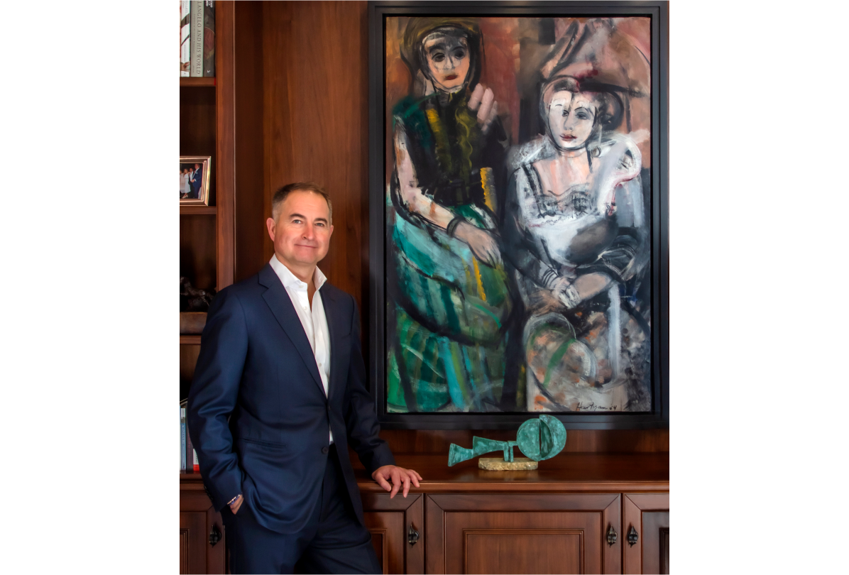 Christian posing in front of a painting