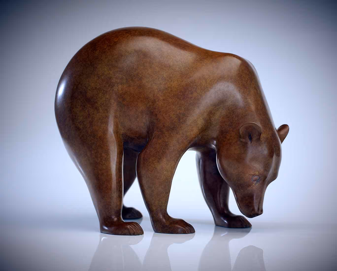 A photo of a hand-carved wooden bear figurine