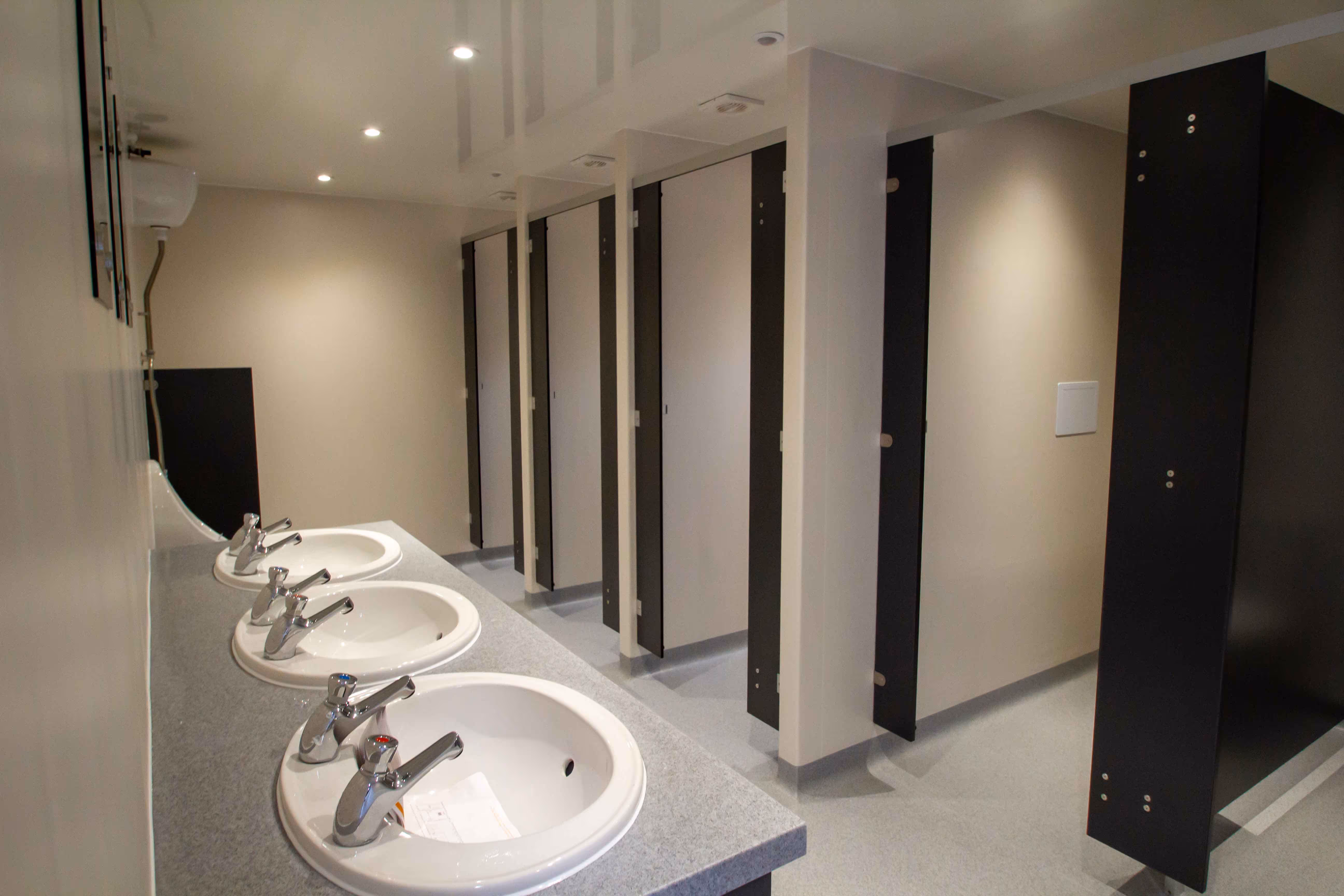 A photo of the interior of a portable toilet block
