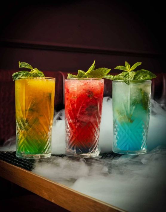 Vibrant Iced drinks topped with fresh garnishes