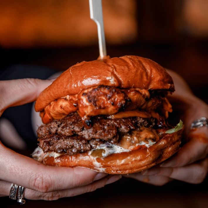 juicy double-patty burger with melted cheese and sauce.
