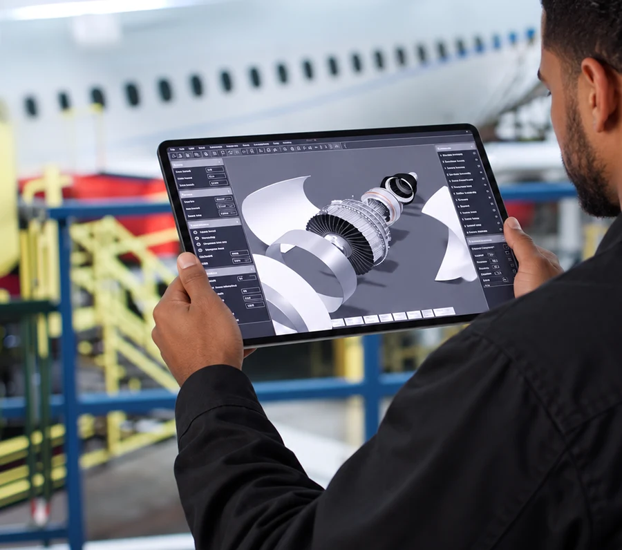 Engineer inspecting a 3D component model on a tablet