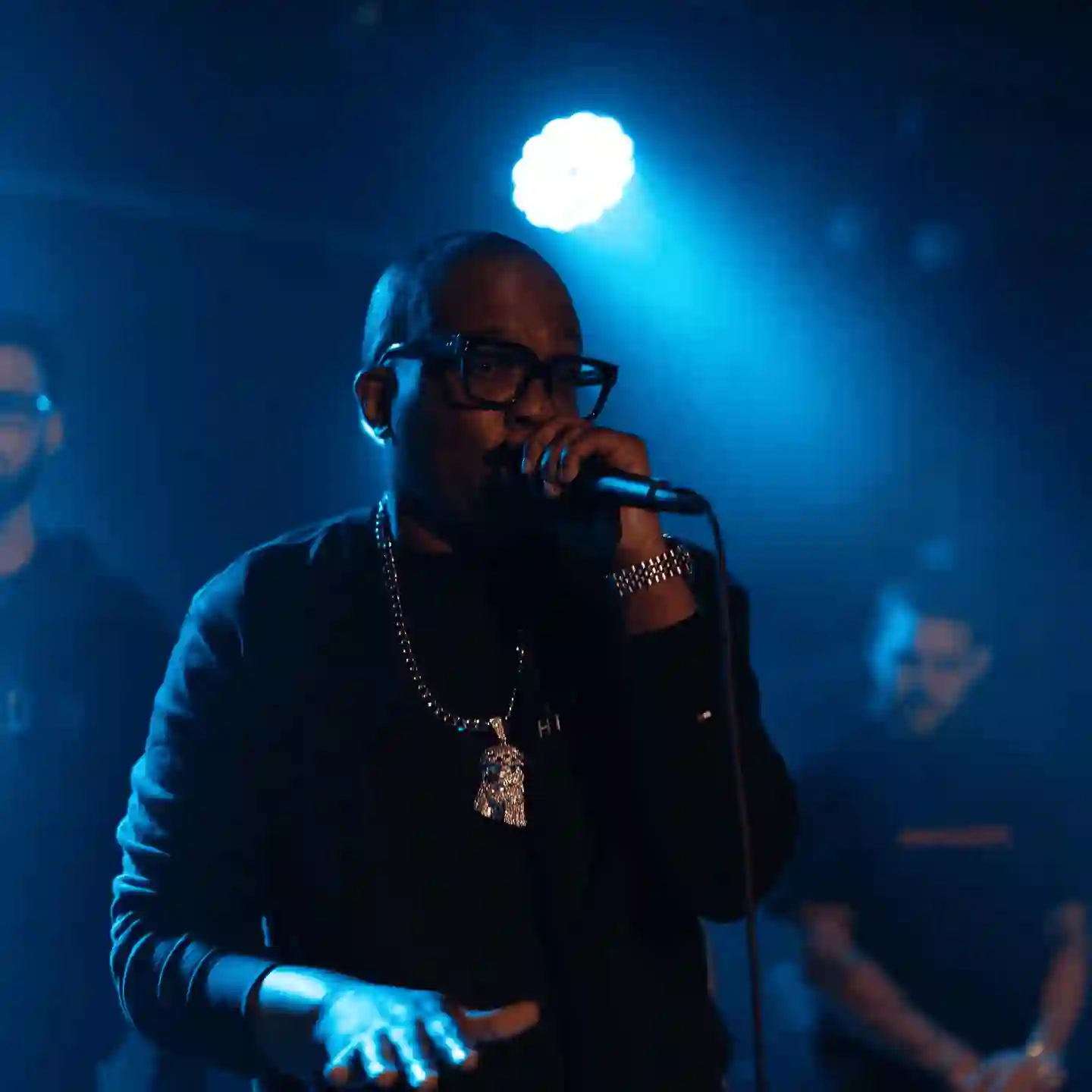 A man standing in front of a microphone on a stage.