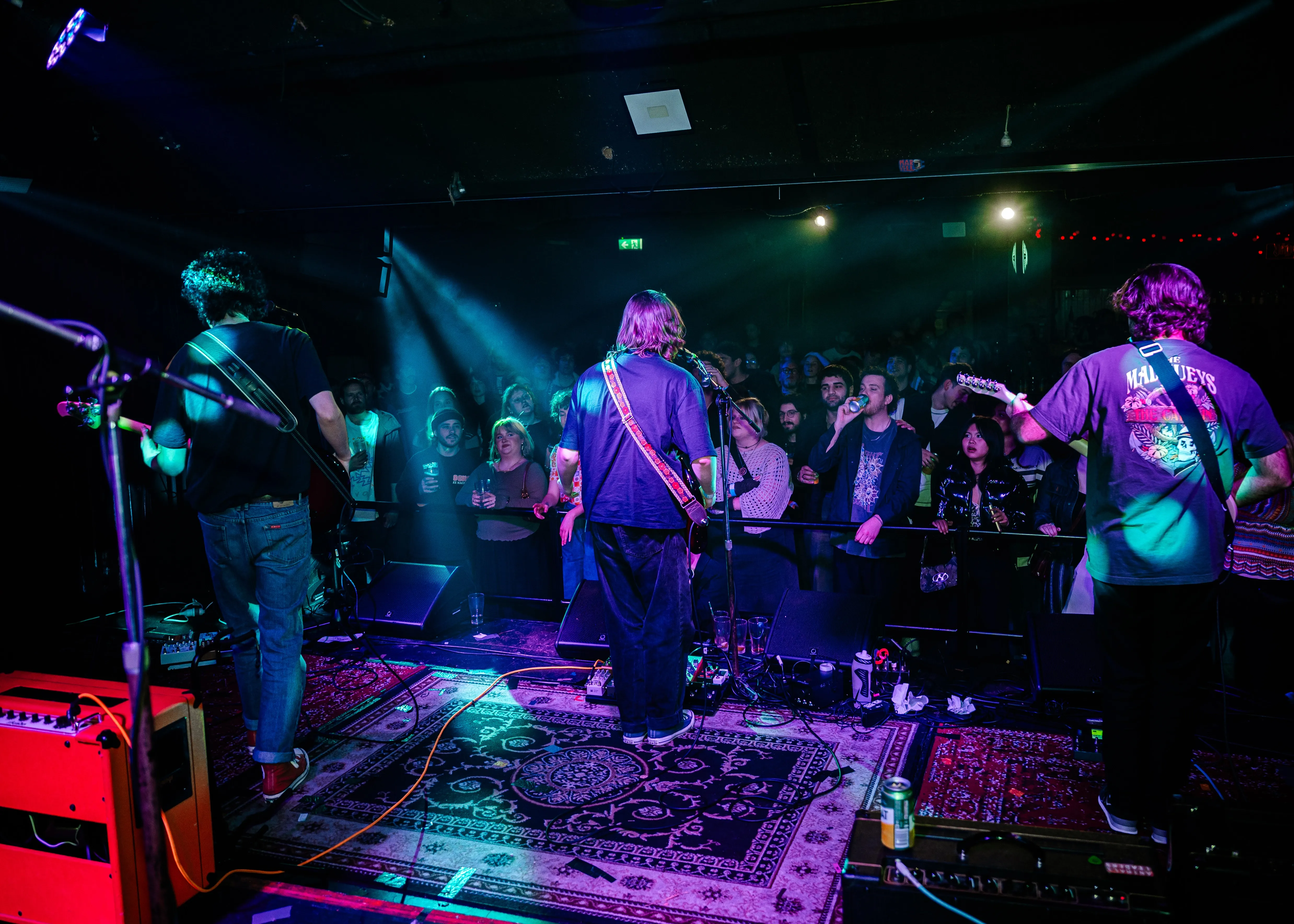 A group of people standing on top of a stage.