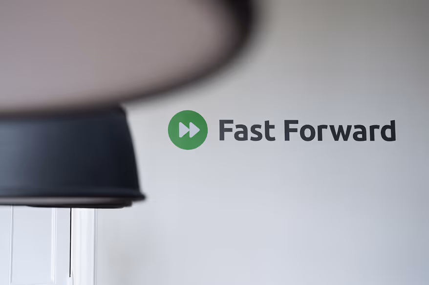 Fast forward text dislayed on the movingimage office wall