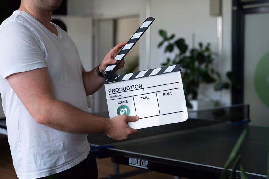 Team member holding a production sign