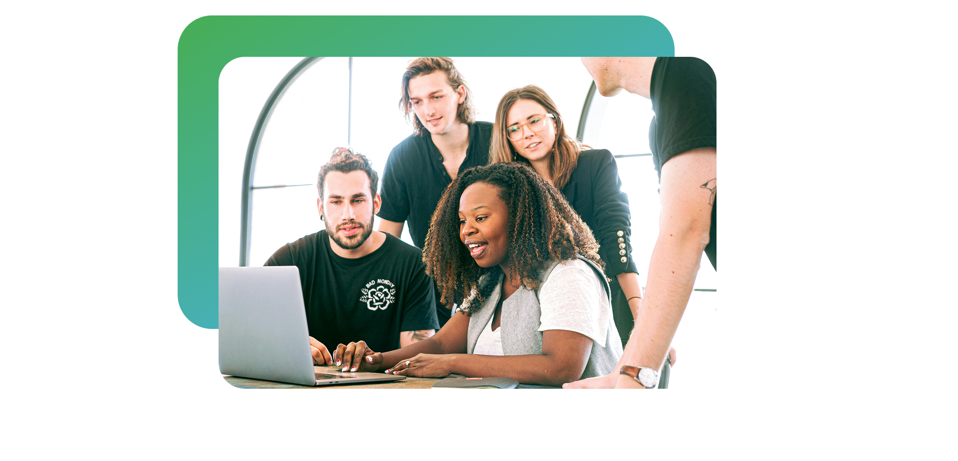 Employees enjoying watching a video on a laptop