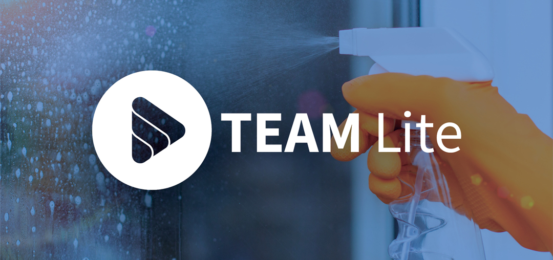 Hand spraying disinfectant with Team Lite logo on misty background