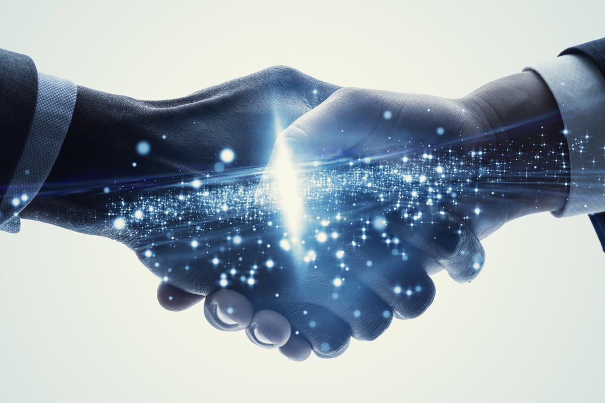 Digital handshake with glowing particles representing technology partnership