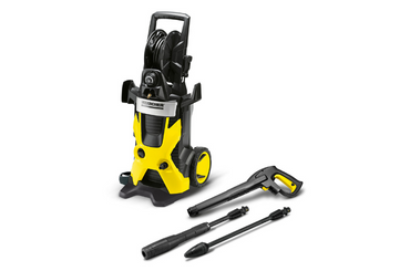 Yellow and black Karcher pressure washer with accessories on white background
