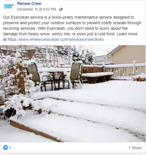 Snow-covered patio with chairs and wooden deck in winter landscape