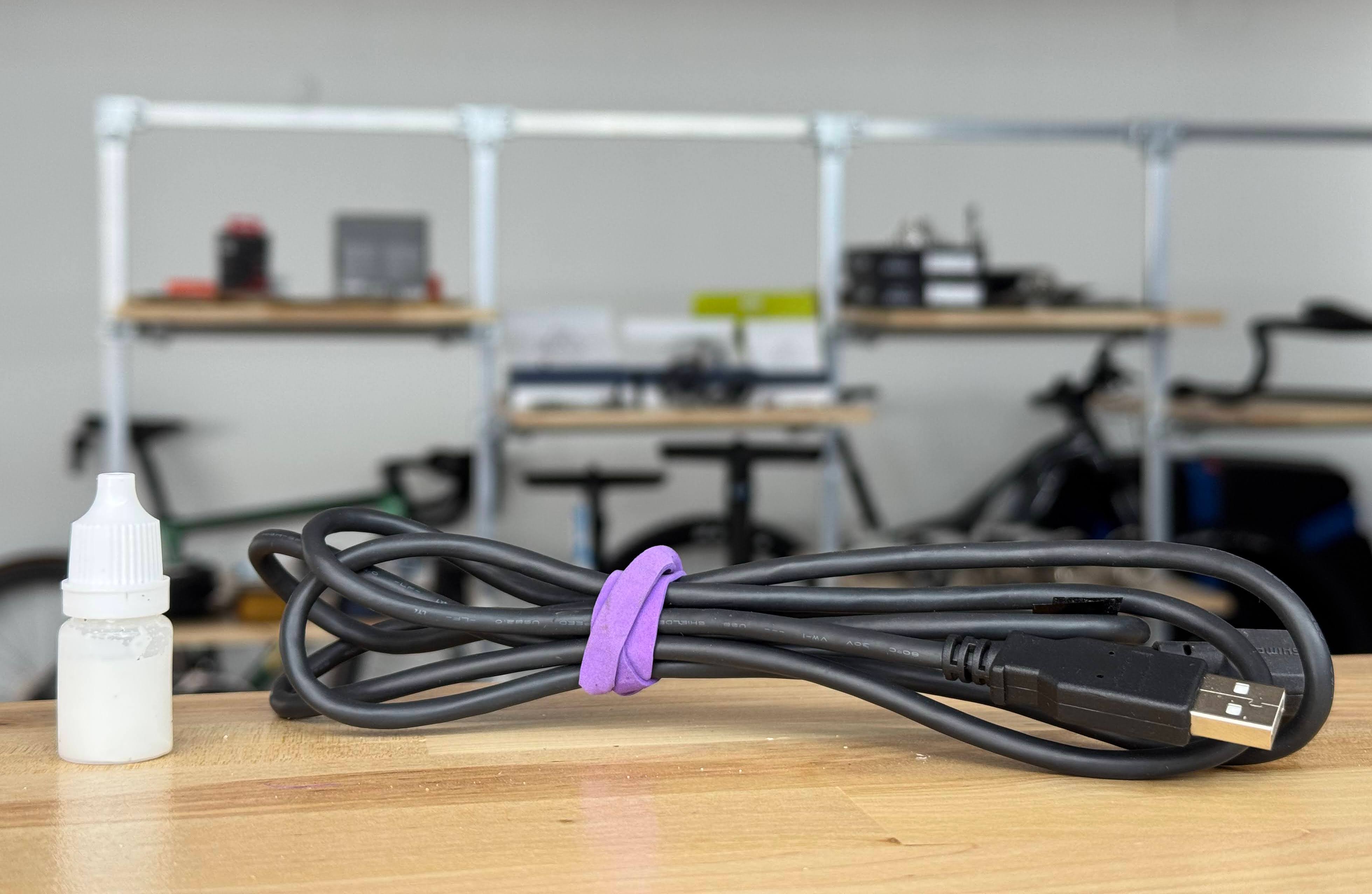 Charger for electronic shifting and wax lube