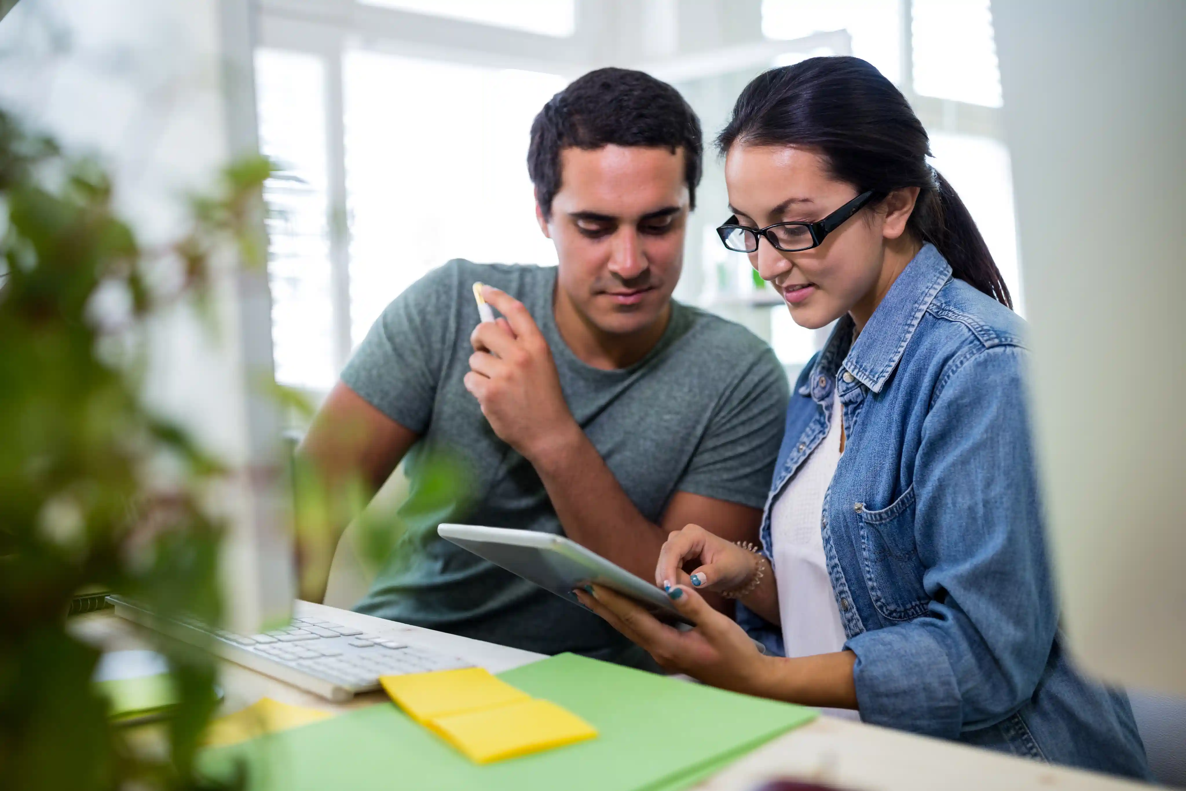 People reviewing tablet
