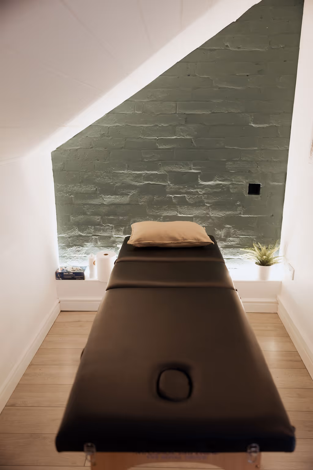 Massage bed in private sports therapy room at ONE DZ Gym Derby