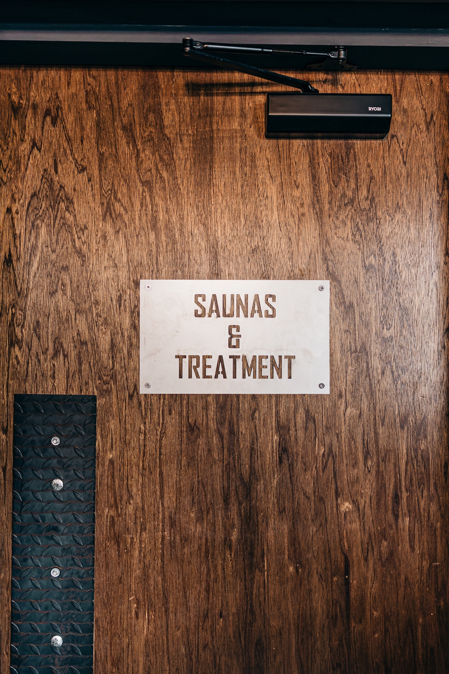 Entrance door to sauna and treatment room at ONE|DZ Gym Derby.
