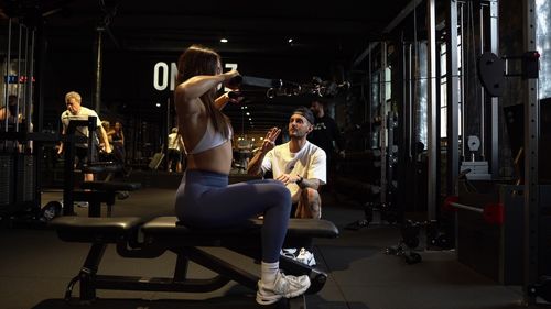 Female client doing lat rows during PT session at ONE|DZ strength gym