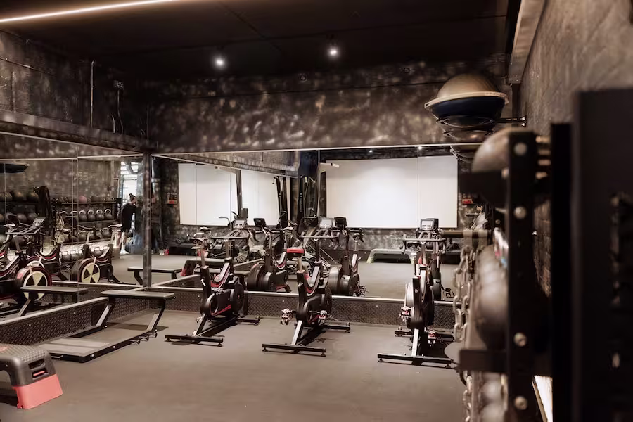 Cardio and functional training room with spin bikes and equipment at ONE|DZ Gym in Derby