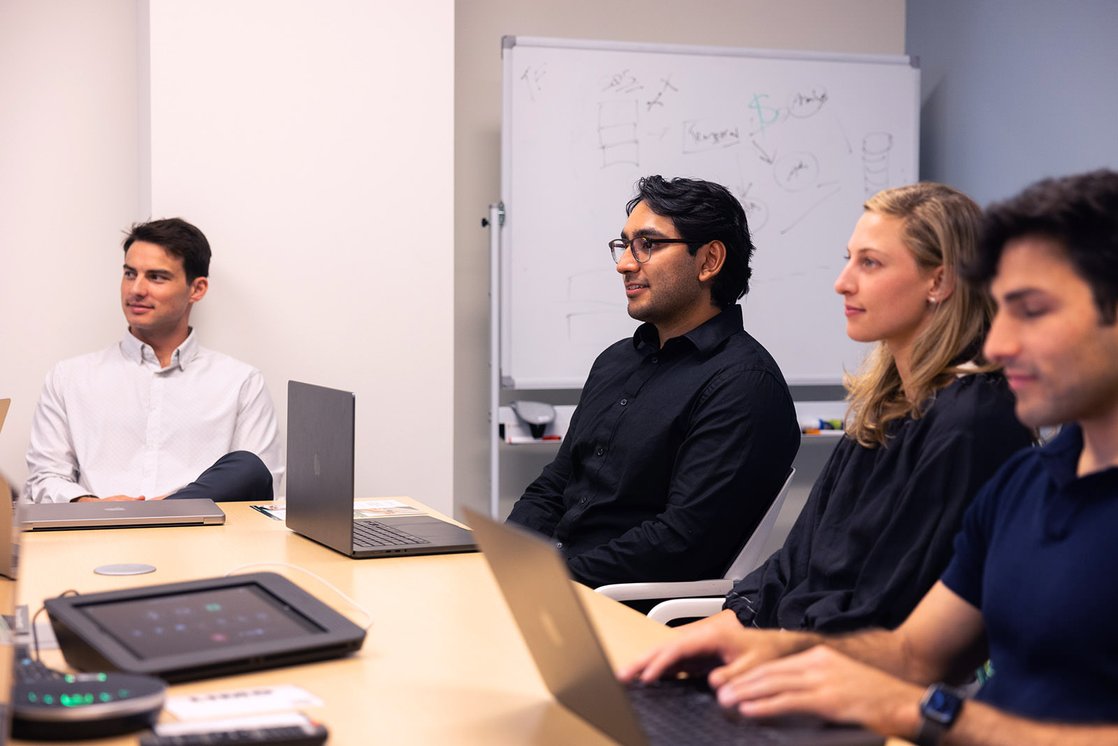 Photo of the Charta Health team in a meeting