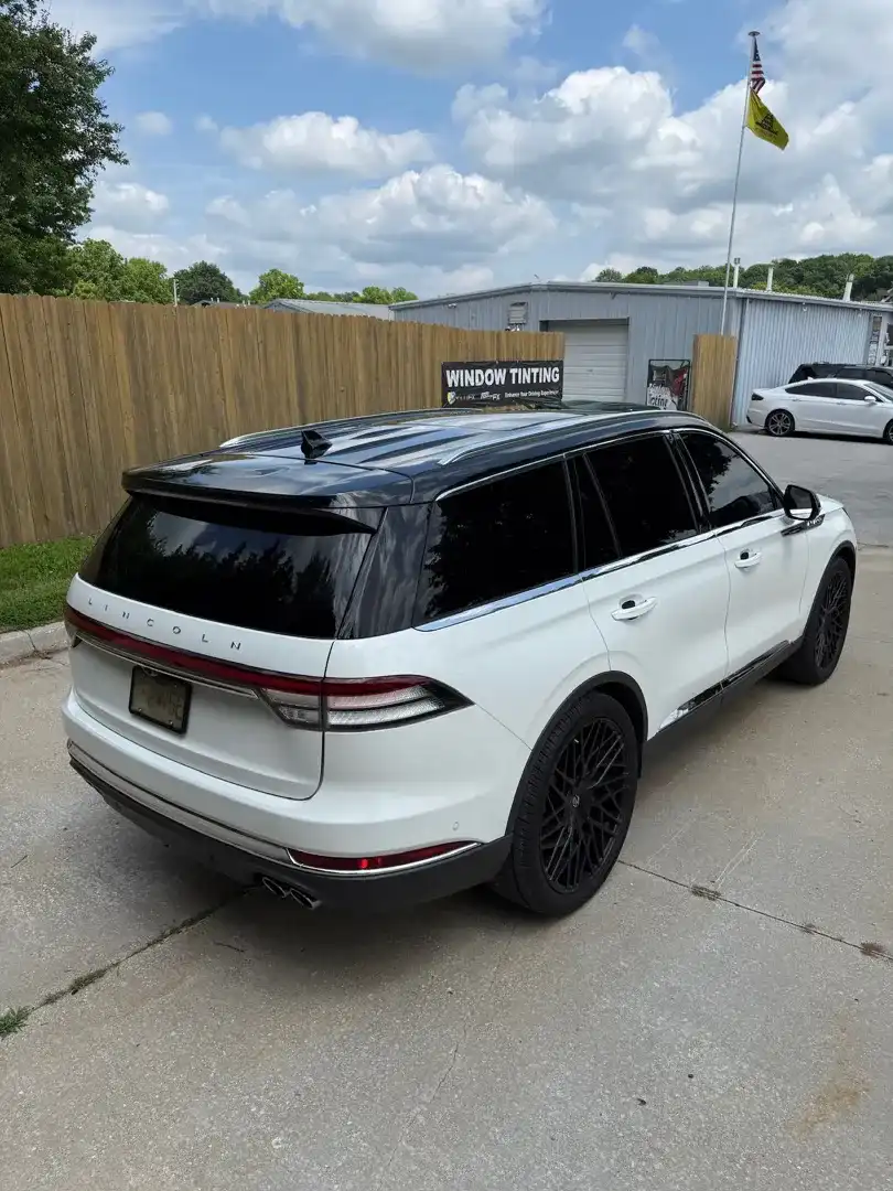 This custom vehicle project showcases a sleek design with a striking color change wrap, expertly crafted by Layrite Customs in Liberty, MO, enhancing its unique style.
