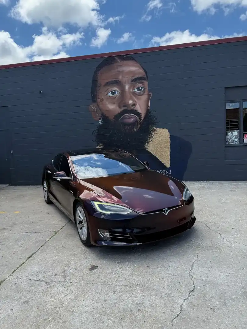 This striking custom vehicle project showcases a sleek automotive customization with a glossy finish, expertly crafted at Layrite Customs in Liberty, MO.