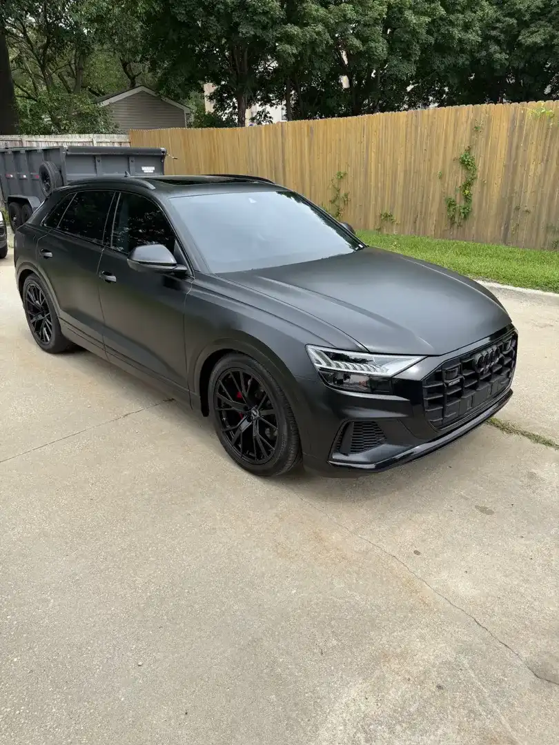 This striking custom vehicle project showcases a sleek design and premium automotive customization that enhances its overall appearance.