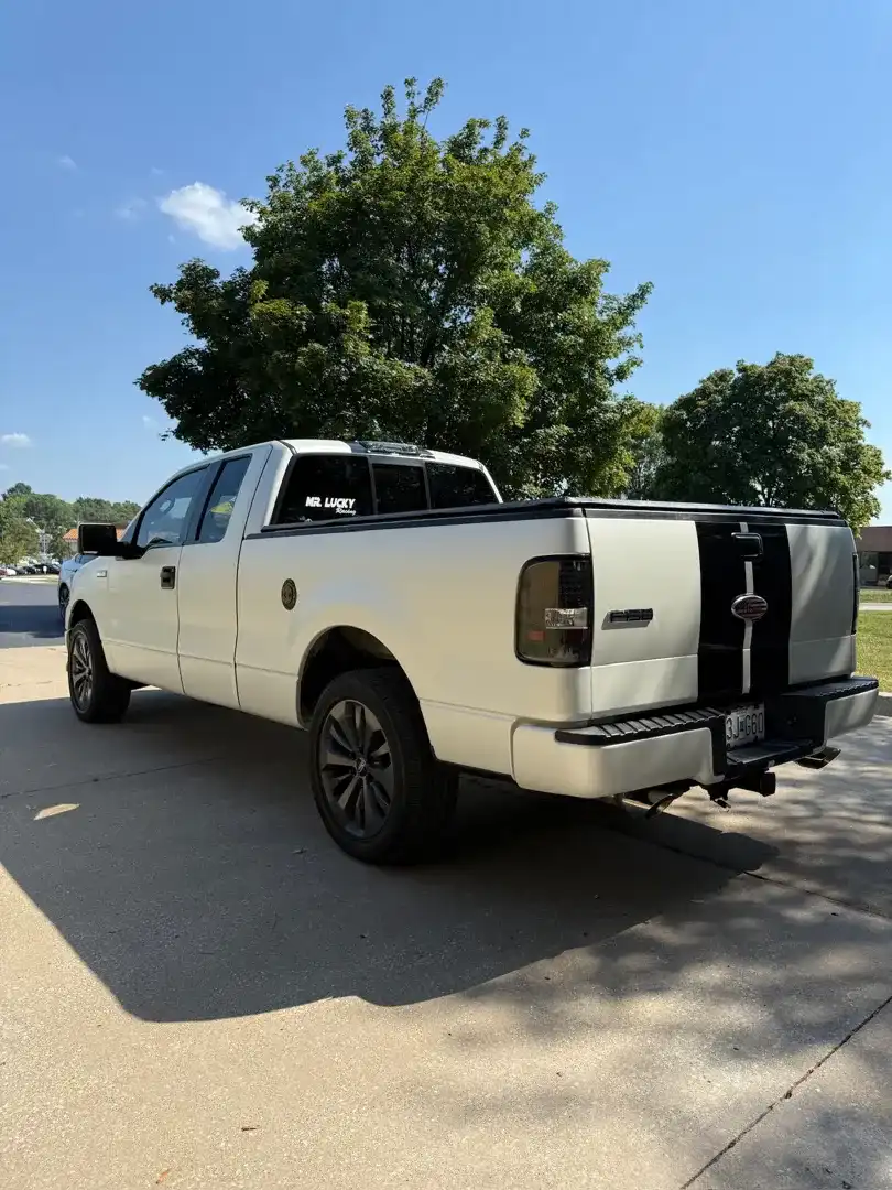 This striking custom vehicle project showcases a sleek automotive customization featuring a stunning color change wrap, expertly crafted at Layrite Customs in Liberty, MO.