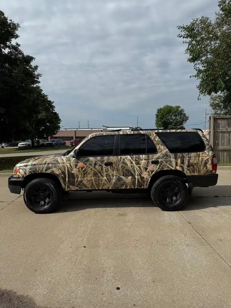 This stunning custom vehicle project showcases a sleek automotive design with a vibrant color change wrap, expertly crafted at Layrite Customs in Liberty, MO.