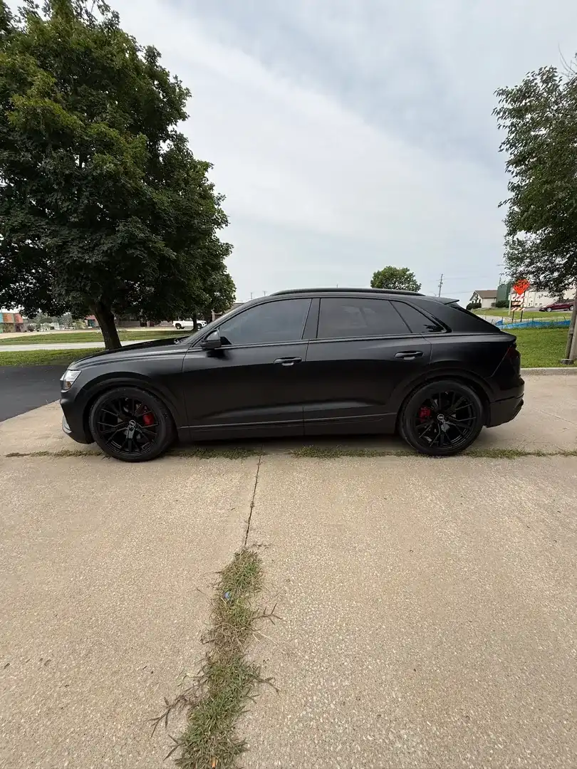 This striking custom vehicle project showcases a sleek design with a professional color change wrap, expertly crafted by Layrite Customs in Liberty, MO.