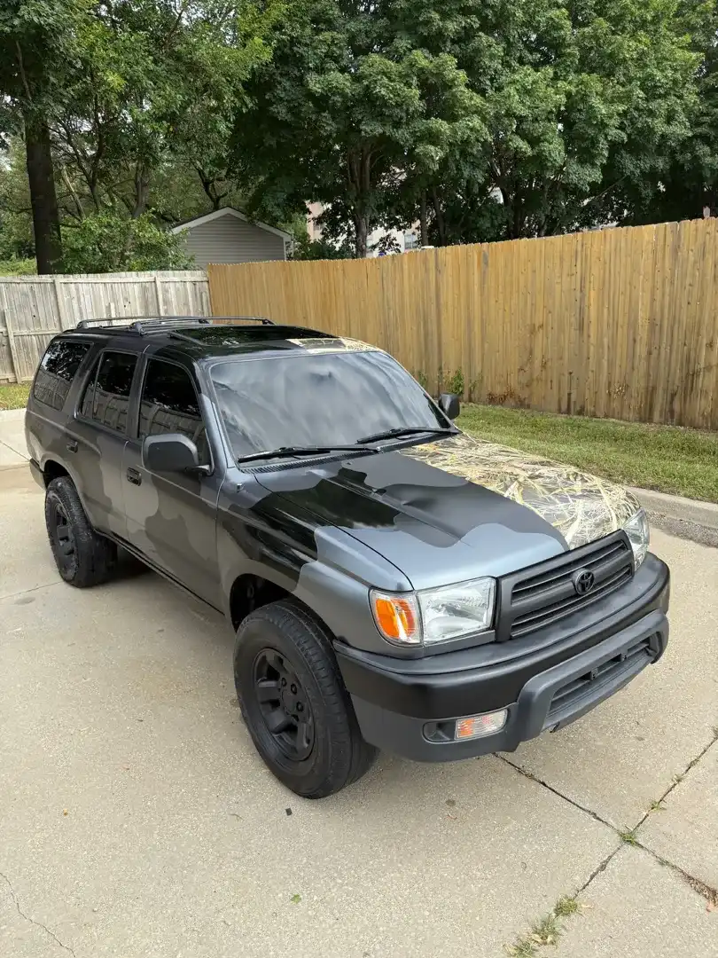 This striking custom vehicle project showcases a stunning color change wrap, expertly applied by Layrite Customs in Liberty, MO, enhancing its overall aesthetic appeal.