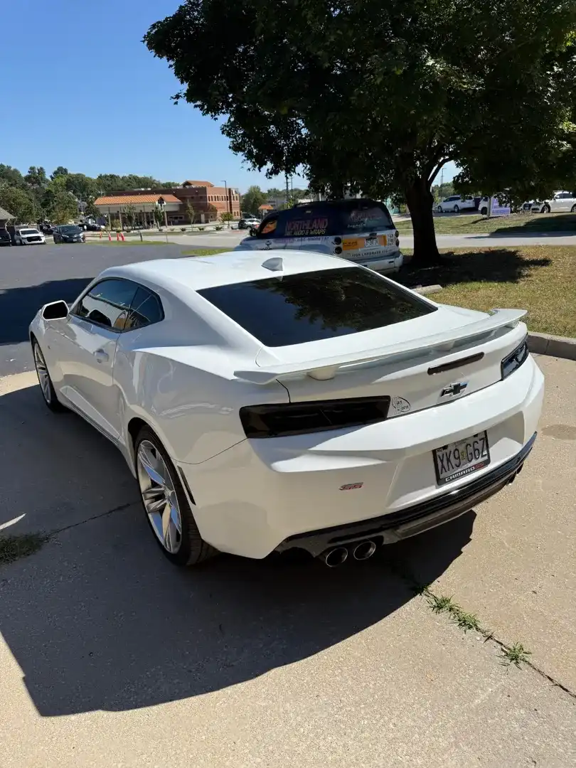 This striking custom vehicle project showcases a sleek design with a stunning color change wrap, reflecting Layrite Customs' expertise in automotive customization.