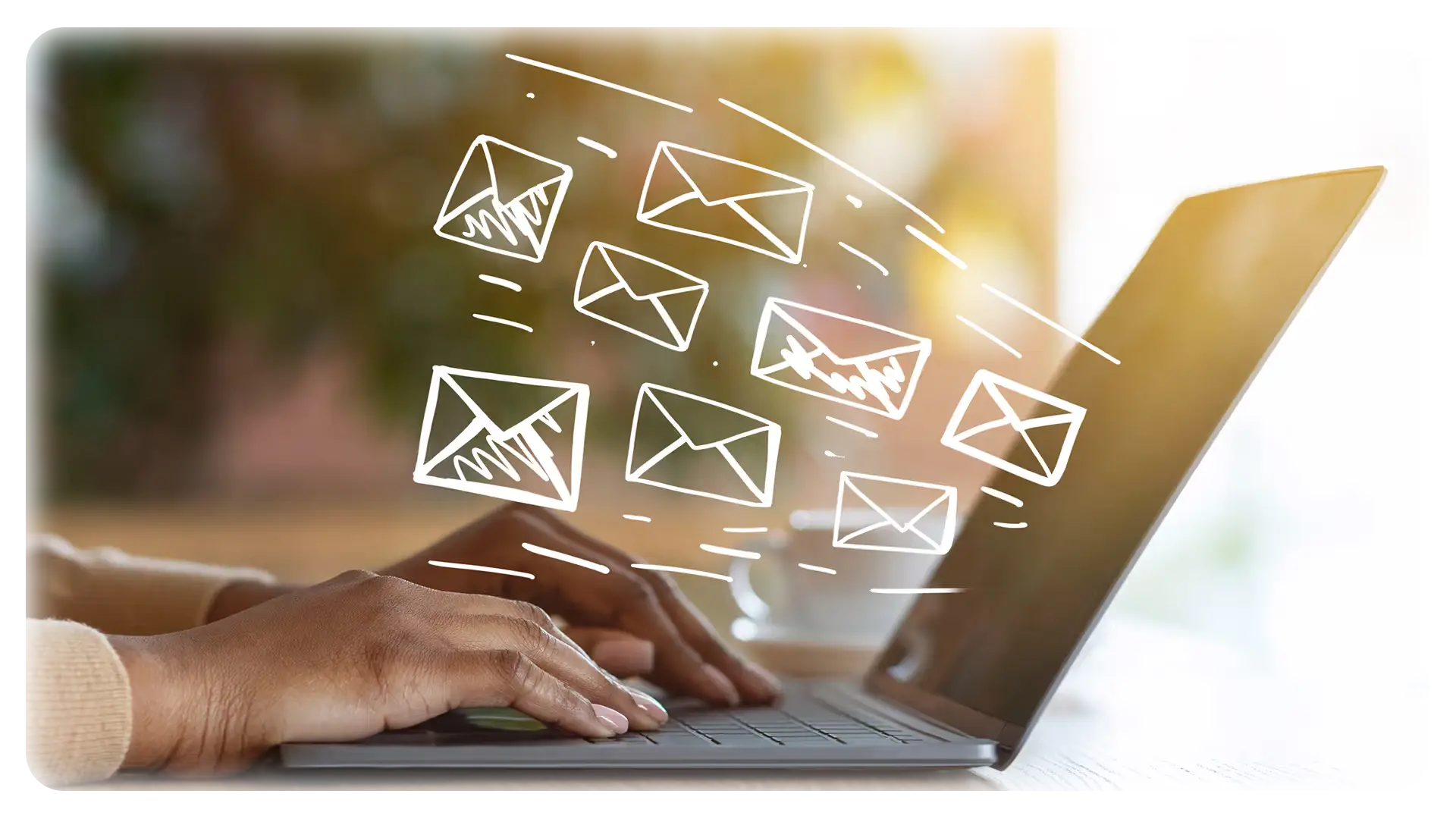 Hands typing on a laptop