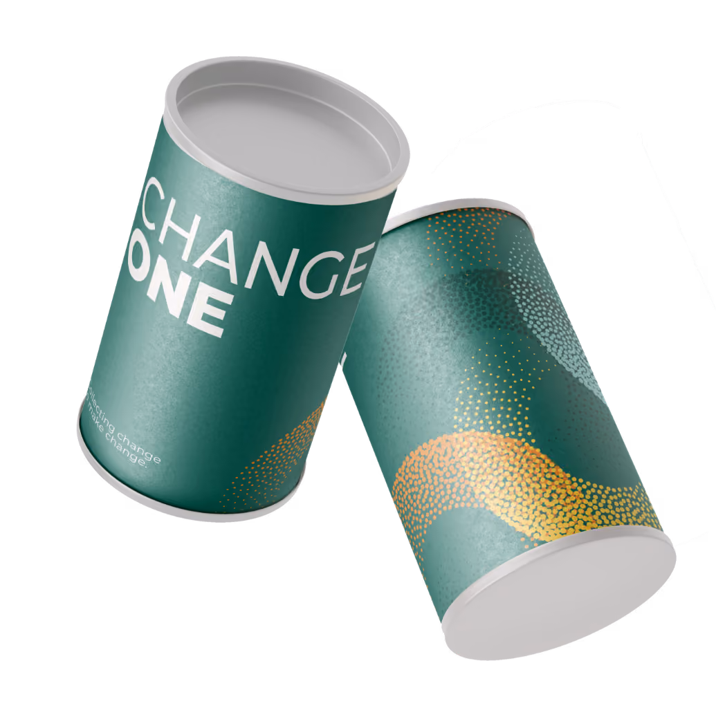 Two green cylindrical containers with white lids, one showing the words 'CHANGE ONE' and abstract yellow dot patterns on their surfaces.