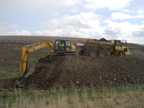 SMAF construction excavator loading large dump truck